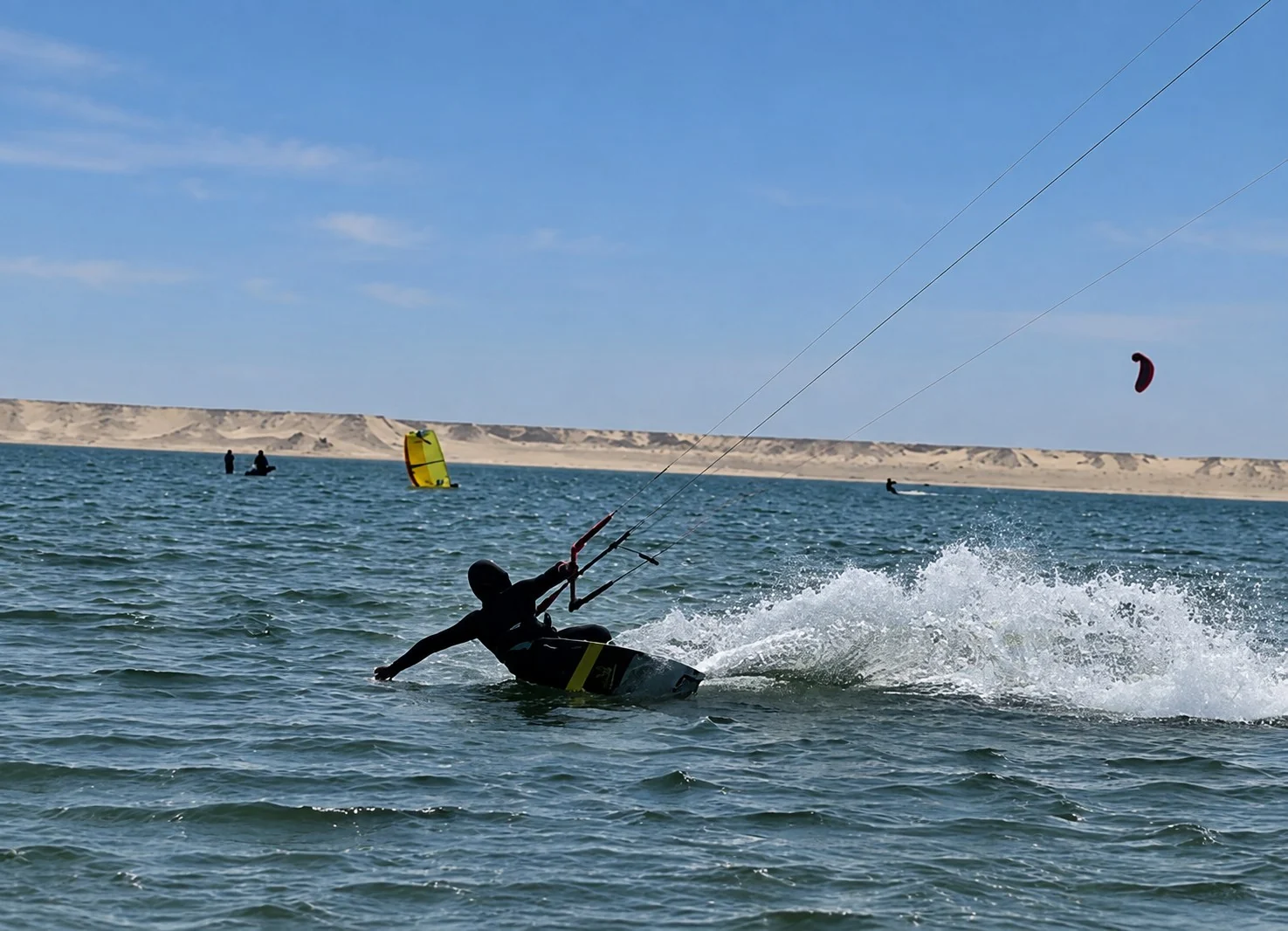 RYDEWIND kitesurf instructor riding across the Dakhla lagoon