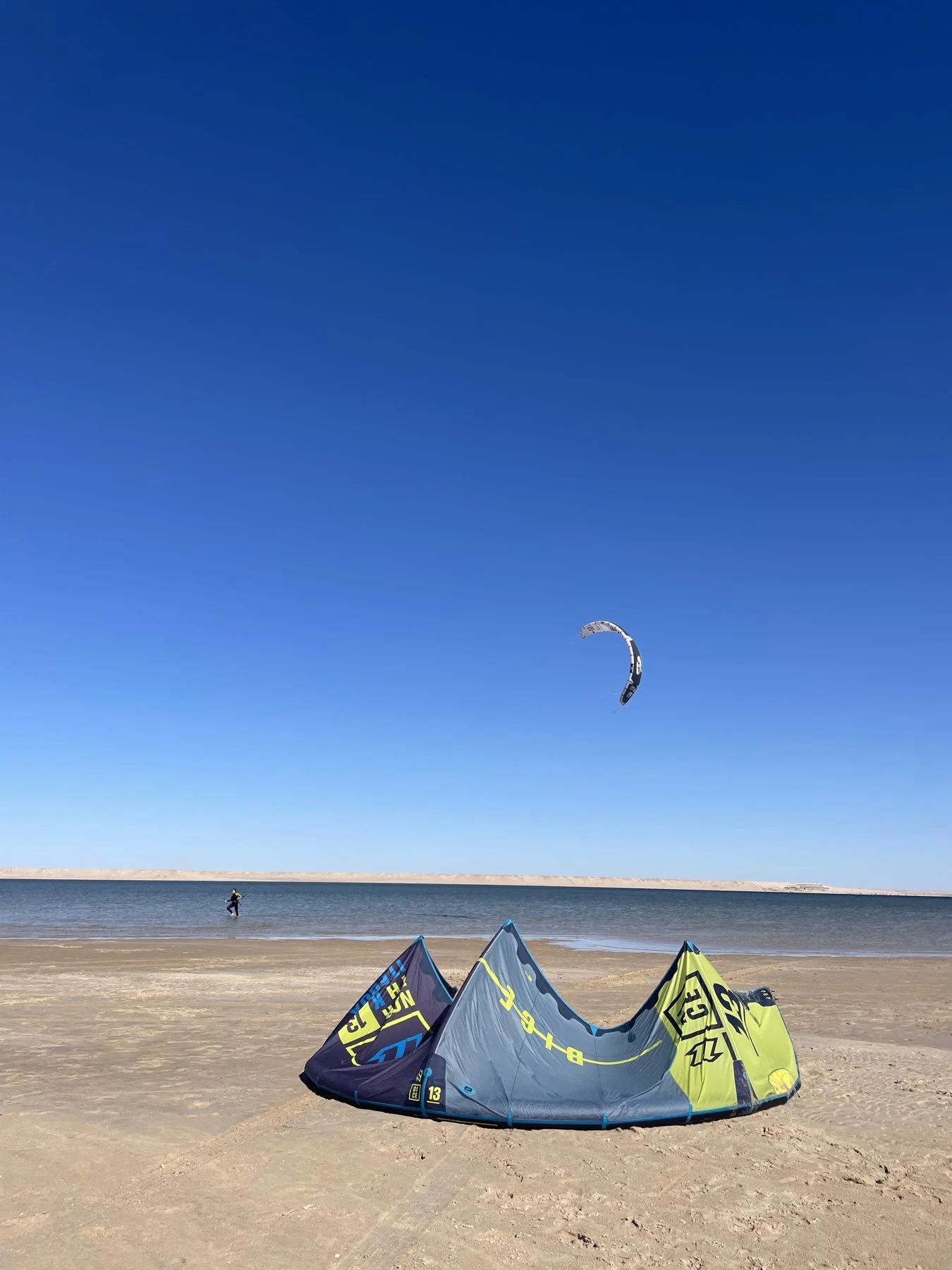 Kitesurf equipment prepared beside the lagoon